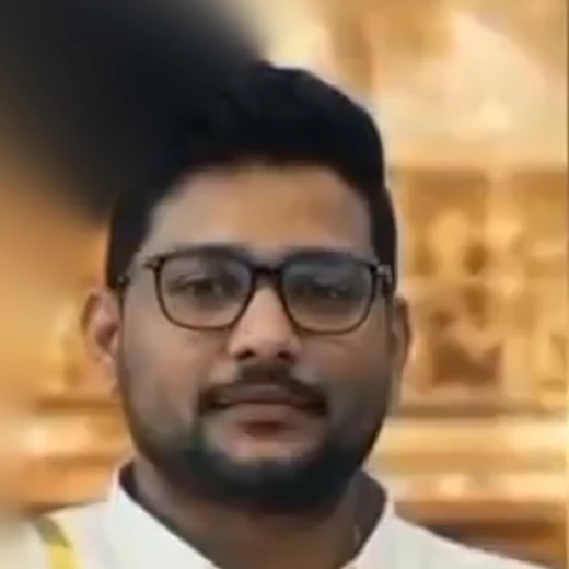 Portrait of an Aurum Crown Jewels founder in a white shirt and glasses