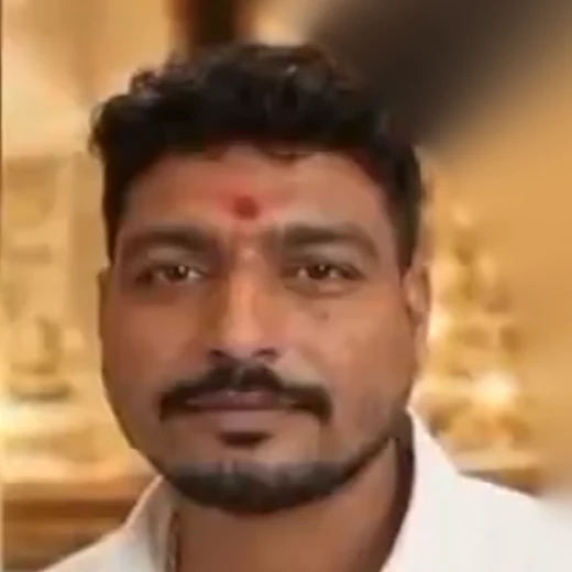 Portrait of an Aurum Crown Jewels founder in a white shirt with a red tilak