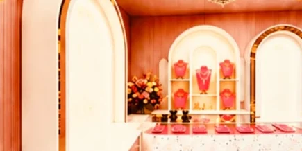 Terrazzo counter with jewellery trays beneath an arched showcase